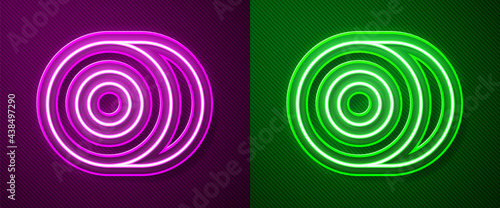 Glowing neon line Skateboard wheel icon isolated on purple and green background. Skate wheel. Vector