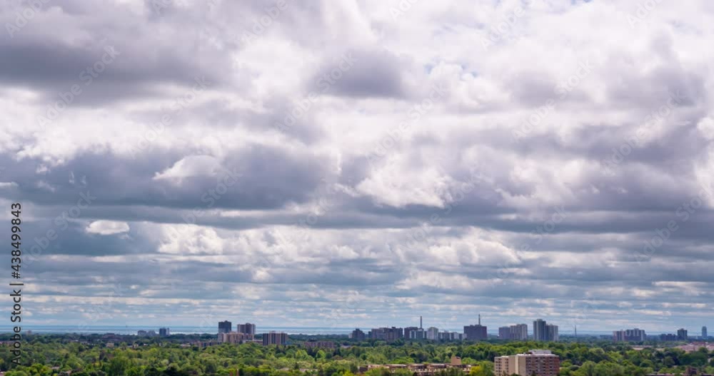 Timelapse of running clouds over American city downtown with feathered clouds in the sky. Toronto Canada rainy summer day. Cloudscape time lapse. 4k raw B-roll footage. Timelapse of running clouds over American city downtown with feathered clouds in the sky. Toronto Canada rainy summer day. Cloudscape time lapse. 4k raw B-roll footage.