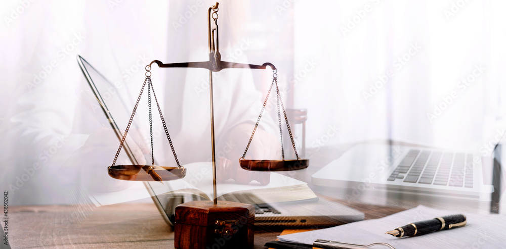 justice and law concept.Male judge in a courtroom on wooden table and Counselor or Male lawyer working in office. Legal law, advice and justice concept.
justice and law concept.Male judge in a courtroom on wooden table and Counselor or Male lawyer working in office. Legal law, advice and justice concept.