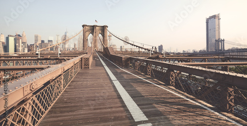 Panoramic view of Brooklyn Bridge, color toned picture, New York City, USA.