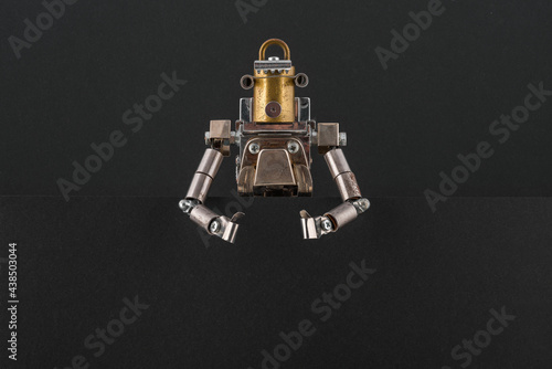 Portrait of a steampunk robot looking around the corner.