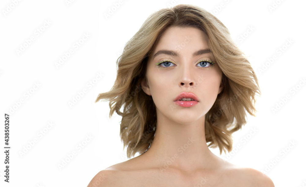 Fashion model with nice professional make-up posing in the studio, isolated on white. Beautiful young woman with perfect skin and wavy hair. Fashion model with nice professional make-up posing in the studio, isolated on white. Beautiful young woman with perfect skin and wavy hair.
