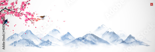 Blossoming sakura branch and misty mountains with gentle slopes. Traditional oriental ink painting sumi-e, u-sin, go-hua.