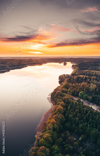 Fototapeta Naklejka Na Ścianę i Meble -  Sunset over the lake and forest shoot from drone