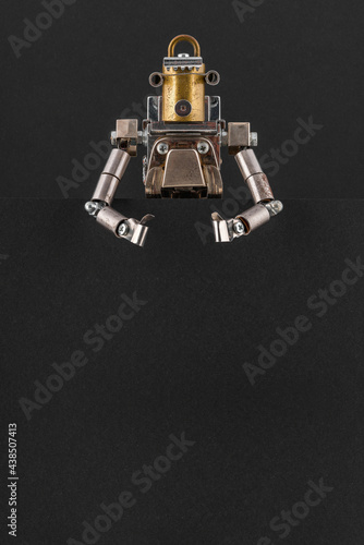 Portrait of a steampunk robot looking around the corner.