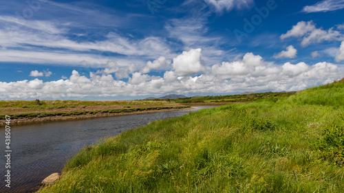 The River Dwyfor flowing through the fields on a summers Day