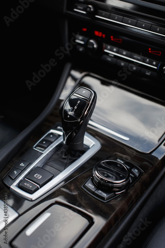 Automatic transmission gear shift in modern car close up. © kucheruk