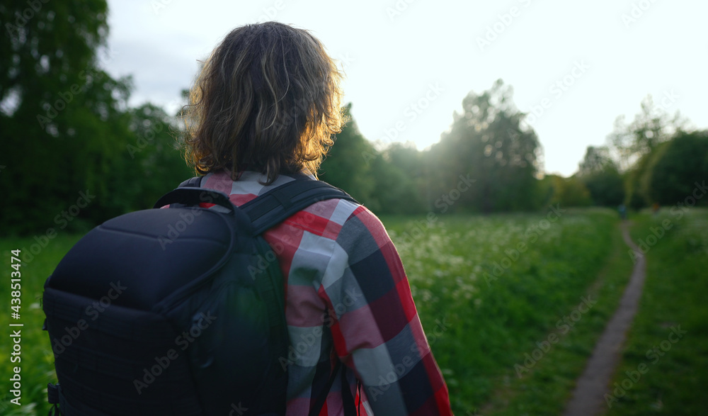 Man with backpack and sunglasses in the woods. Arc shoot. Man with backpack and sunglasses in the woods. Arc shoot.