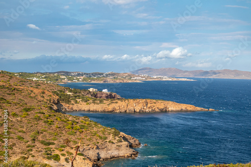 Fototapeta Naklejka Na Ścianę i Meble -  Rocky cliffs, sea shore landscape near Athens from Cape Sounion. Vibrant colorful view with scenic clouds and blue Mediterranean stormy sea