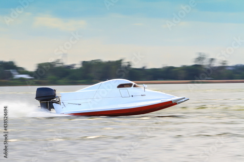 Formula 5 boat go fast along the lake in Powerboat competition