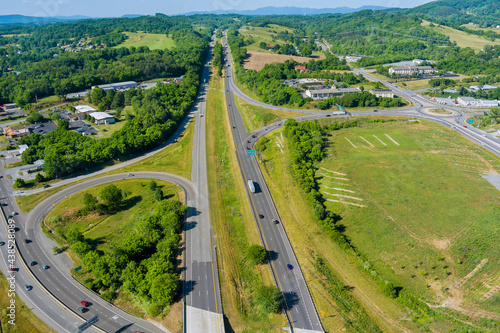 Aerial view of highway intersection traffic road in Daleville town with valley mountains in West Virginia
