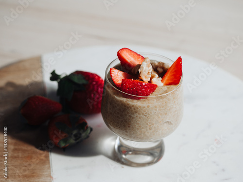 Chia seed pudding in glass with strawberries
