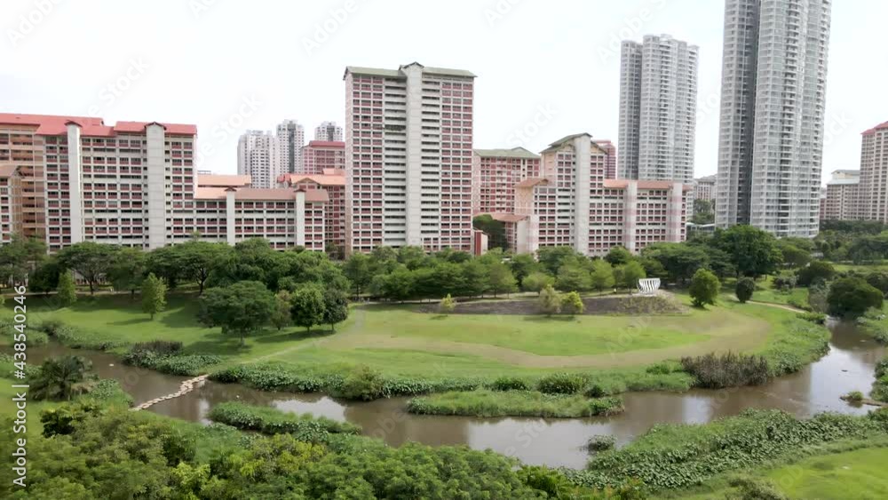 Empty Park Along Kallang River During COVID-19 Pandemic Near Housing And Development In Bishan, Singapore. - aerial ascend, slow motion Empty Park Along Kallang River During COVID-19 Pandemic Near Housing And Development In Bishan, Singapore. - aerial ascend, slow motion