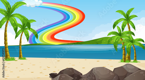 Beach landscape scene with rainbow in the sky