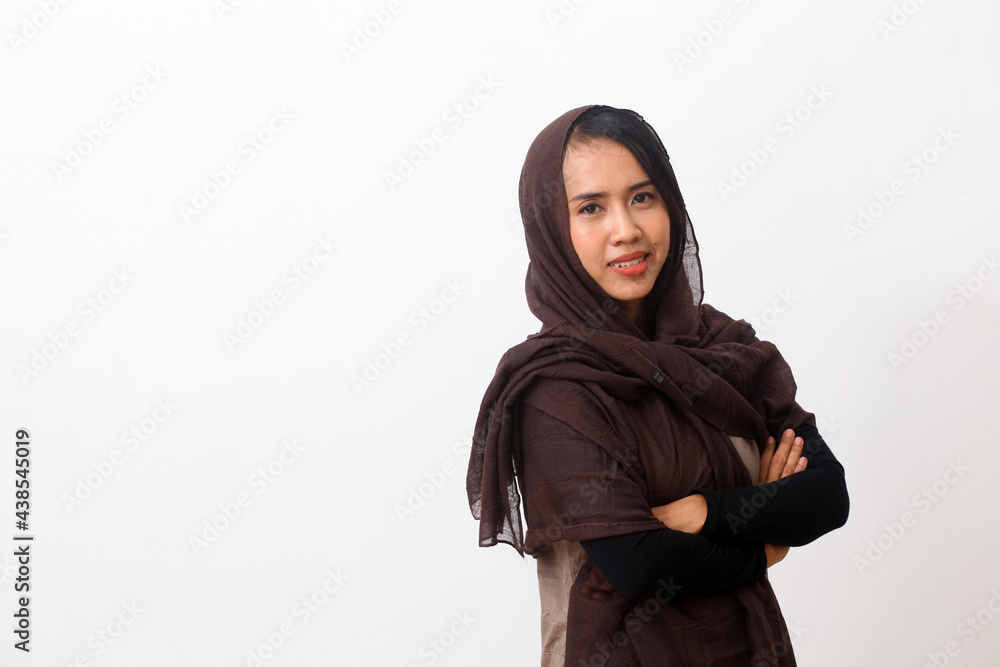 A portrait of happy asian muslim woman wearing a veil or hijab smiling and looking at the camera. Isolated on white background with copy space A portrait of happy asian muslim woman wearing a veil or hijab smiling and looking at the camera. Isolated on white background with copy space