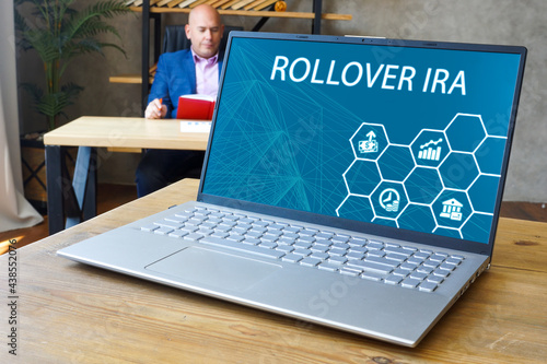 Quadro su tela Individual Retirement Accounts ROLLOVER IRA inscription on the laptop