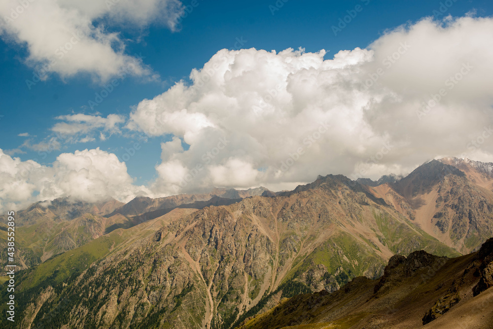 high mountains and blue sky with clouds. High quality photo