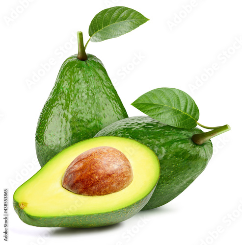 Whole avocado and cut avocado on white background. Organic avocado isolated on white background. Taste avocado with leaf