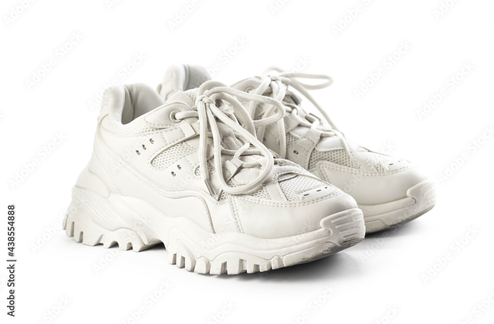 Light leather womens sneakers. Close up. Isolated on a white background Light leather womens sneakers. Close up. Isolated on a white background
