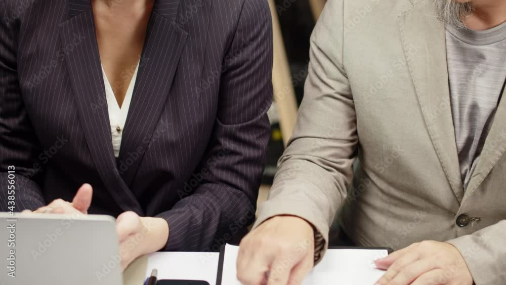 A woman at her desk is inappropriately crowded and touched by her supervisor - Concept: sexual harassment, inappropriate, unethical, illegal behavior A woman at her desk is inappropriately crowded and touched by her supervisor - Concept: sexual harassment, inappropriate, unethical, illegal behavior