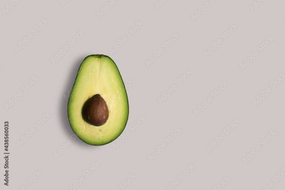 Fresh avocado on a white background for the menu. Geometric background. Flat lay, copy space, top view.