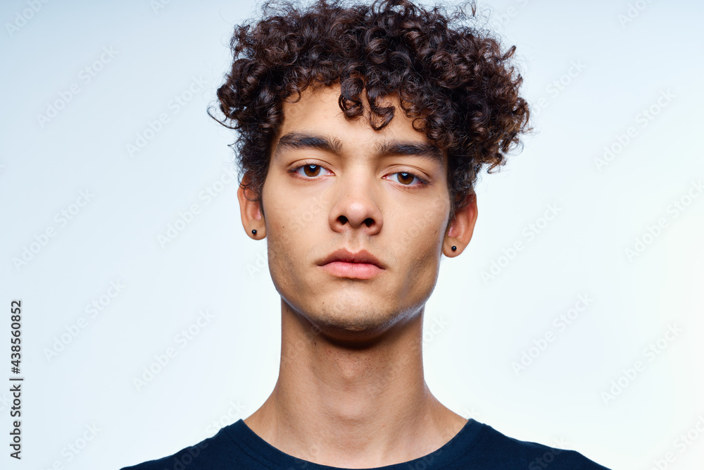 Fototapeta premium cute guy with curly hair cropped view isolated background studio