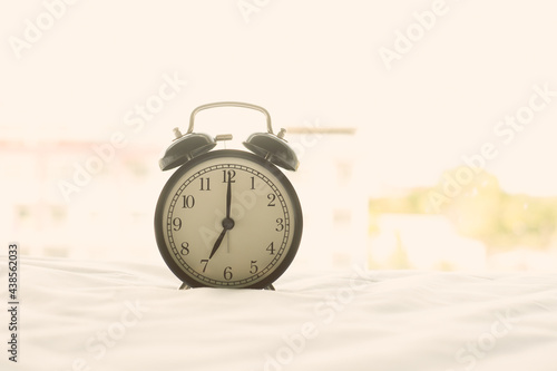 Alarm clock on blur background with copy space for you design.