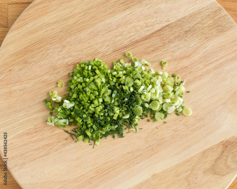 Sliced green onions on a cutting board Sliced green onions on a cutting board