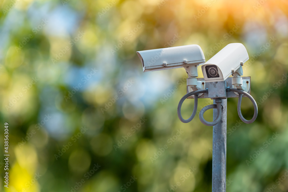 IP CCTV camera install by have water proof cover to protect camera with home security system concept IP CCTV camera install by have water proof cover to protect camera with home security system concept
