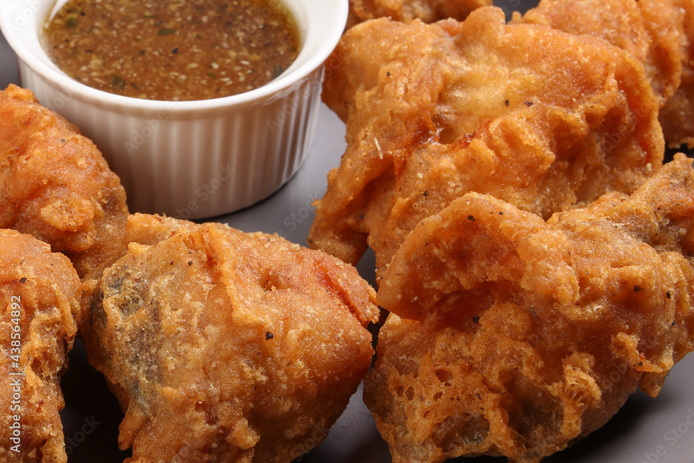 Light battered deep fried chicken variety mix pieces pile flaky meat on