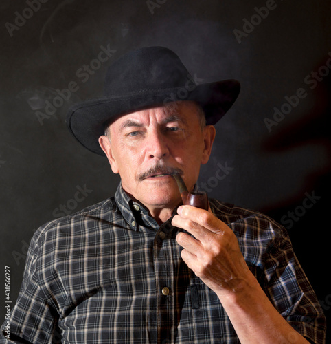 Cowboy in hat with Pipe © Aleksandr