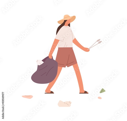 Person holding bag for garbage and tongs for collecting litter. Female volunt...
