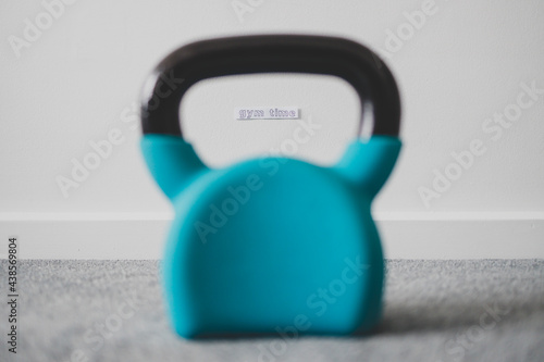 Fototapeta Naklejka Na Ścianę i Meble -  home gym and exercising in your spare time, kettlebell on the floor with Gym Time message