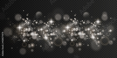 White png dust light.  Light sparkling dust with white sparkling stars on a transparent background.Glittering texture. Christmas effect for luxury greeting rich card. 