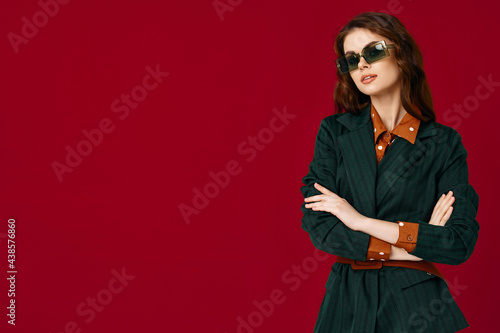 pretty brunette in trendy suit modern style sunglasses isolated background