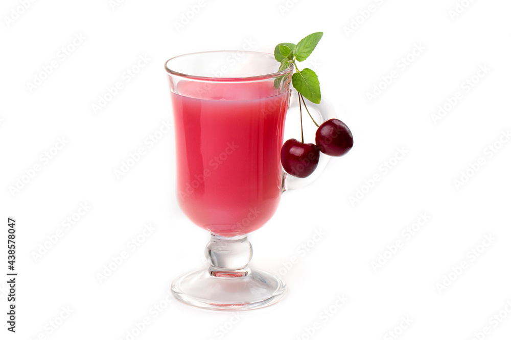 Milk cocktail with cherry in a clear glass and berries on a light background. Milk cocktail with cherry in a clear glass and berries on a light background.
