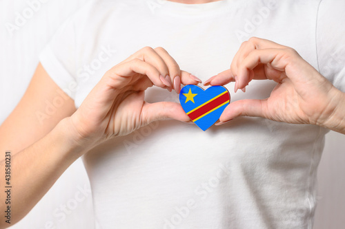 Wallpaper Mural Flag of Democratic Republic of Congo in the shape of a heart in the hands of a girl. Love Congo. Respect for the people of Congo Torontodigital.ca