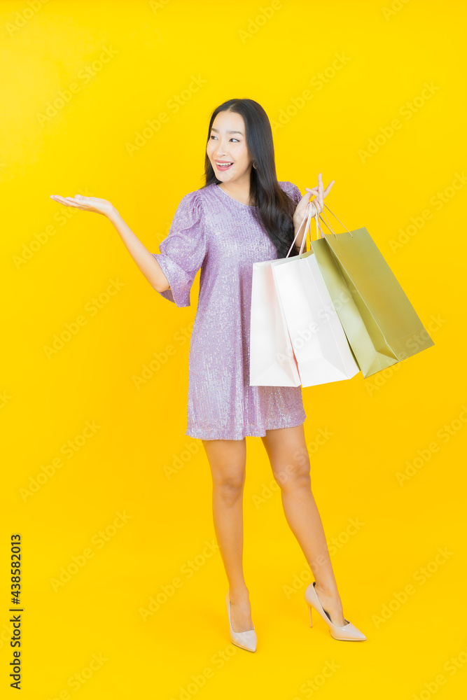 Portrait beautiful young asian woman smile with shopping bag Portrait beautiful young asian woman smile with shopping bag