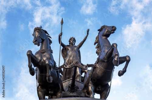 Bronze Boudica staue against summer sky in London, UK. This statue was commissioned in the 19th Century by Queen Victoria, and represents Boudica, or Boadicea, queen of the Celtic Iceni tribe.