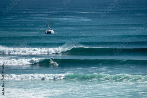Surfer on perfect blue wave, in the barrel, clean water, Indian Ocean .