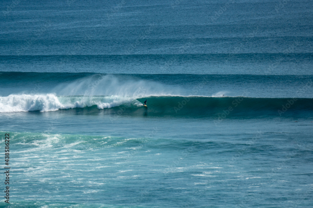 Fototapeta premium Surfer on perfect blue wave, in the barrel, clean water, Indian Ocean .