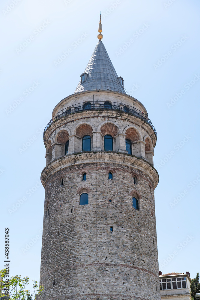 Famous tourist place Galata tower seems between old traditional buildings. Empty street, no people. Istanbul during coronavirus lockdown.