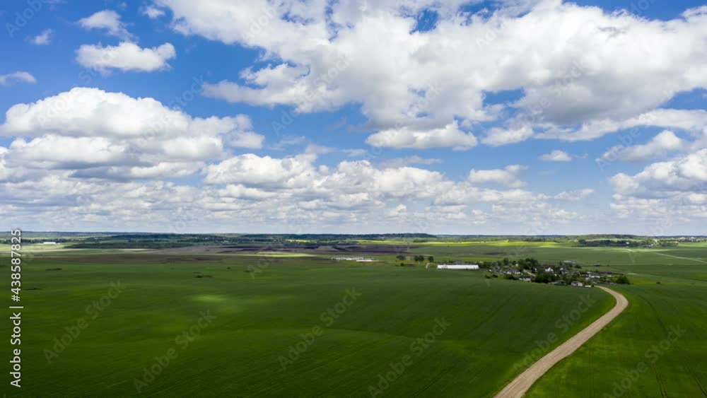 Aerial view of agricultural landscape with fields in summer season. Beautiful rural landscape in bird's-eye view, hyperlapse Aerial view of agricultural landscape with fields in summer season. Beautiful rural landscape in bird's-eye view, hyperlapse