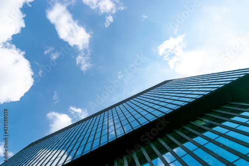 City buildings work. Modern office business building with glass, steel facade exterior. Finance corporate architecture city in abstract blue sky with nature cloud in sunny day.