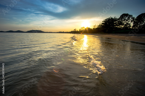 evening sandy beach golden sunlight