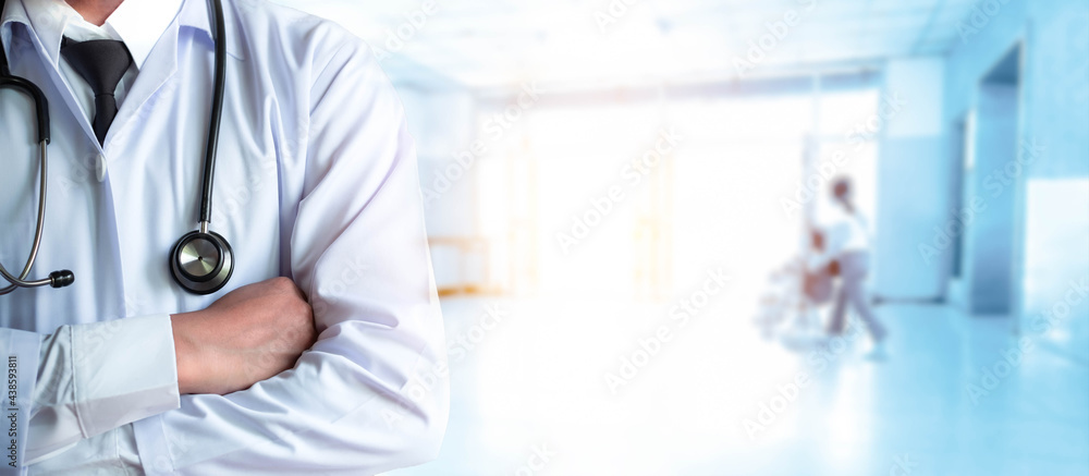 Healthcare and medical concept. Professional medicine doctor in uniform with a stethoscope. Physician specialist standing in clinic or hospital background. - obrazy, fototapety, plakaty 