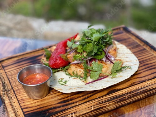 chicken kebab with pita bread, vegetables and sauce outdoor