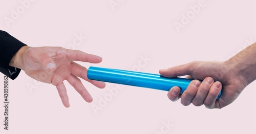 Composition of two people with blue relay baton on pink background