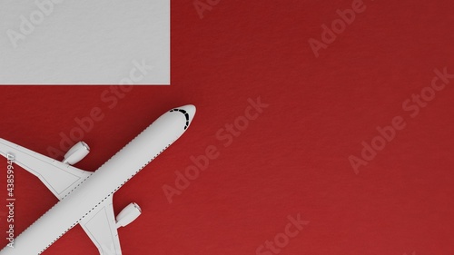 Top Down View of a Plane in the Corner on Top of the Flag of Abu Dhabi