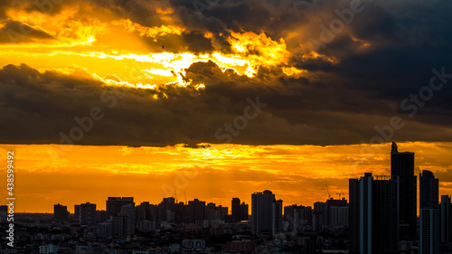 The blurred abstract background of the morning sun exposure to the tiny dust particles that surround the tall buildings in the capital  the long-term health issue of pollution